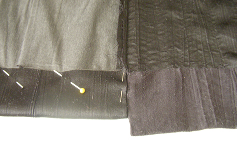 Don't expect a crisp crease when ironing this mock suede polyester. Use a damp cloth, and press only on the wrong side of the fabric. Don't linger with the iron. You risk flattening the crinkle texture pattern if there is too much direct heat.
